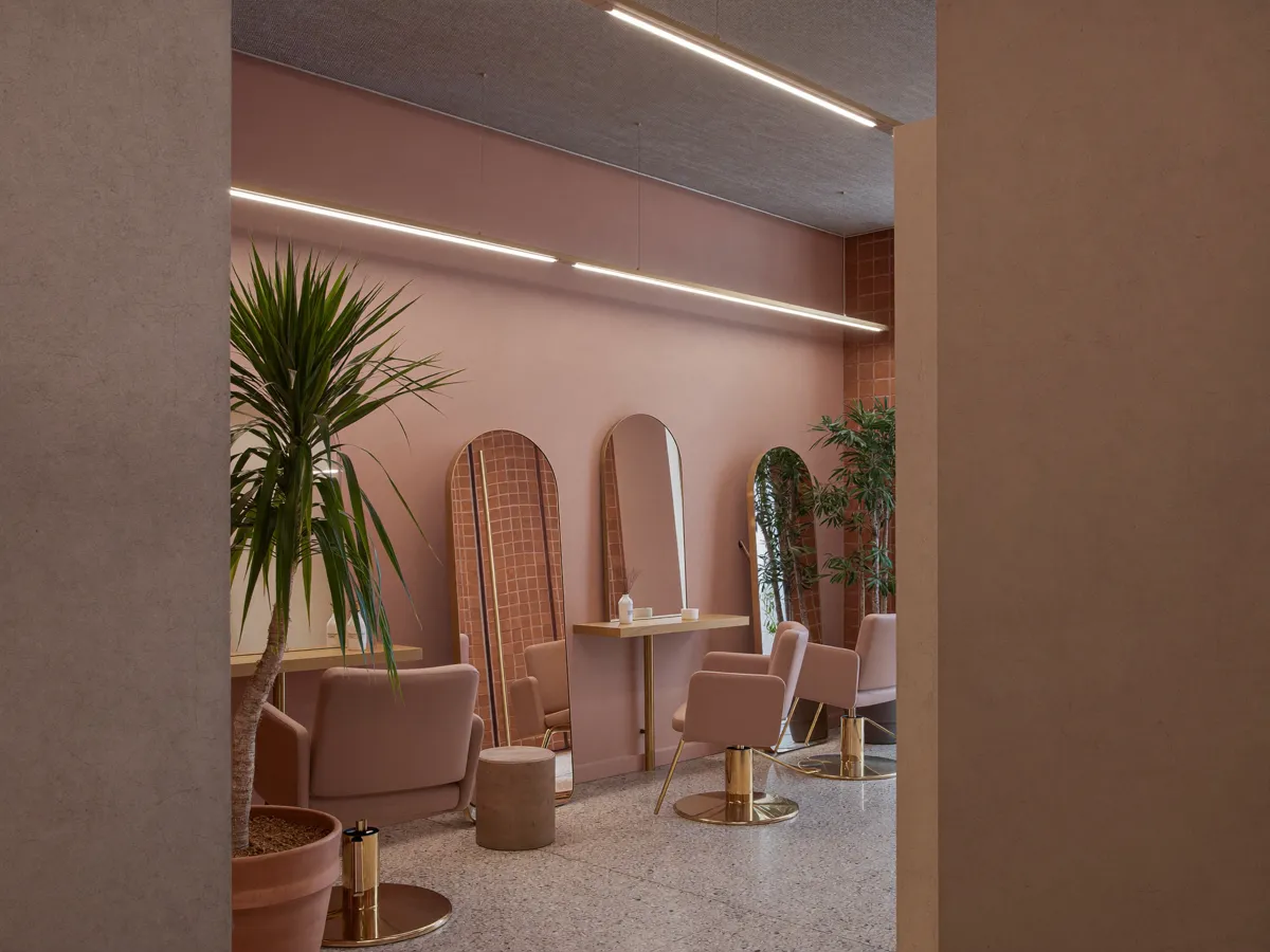 Salon interior from one of the demo builds — arched mirrors and terrazzo floor