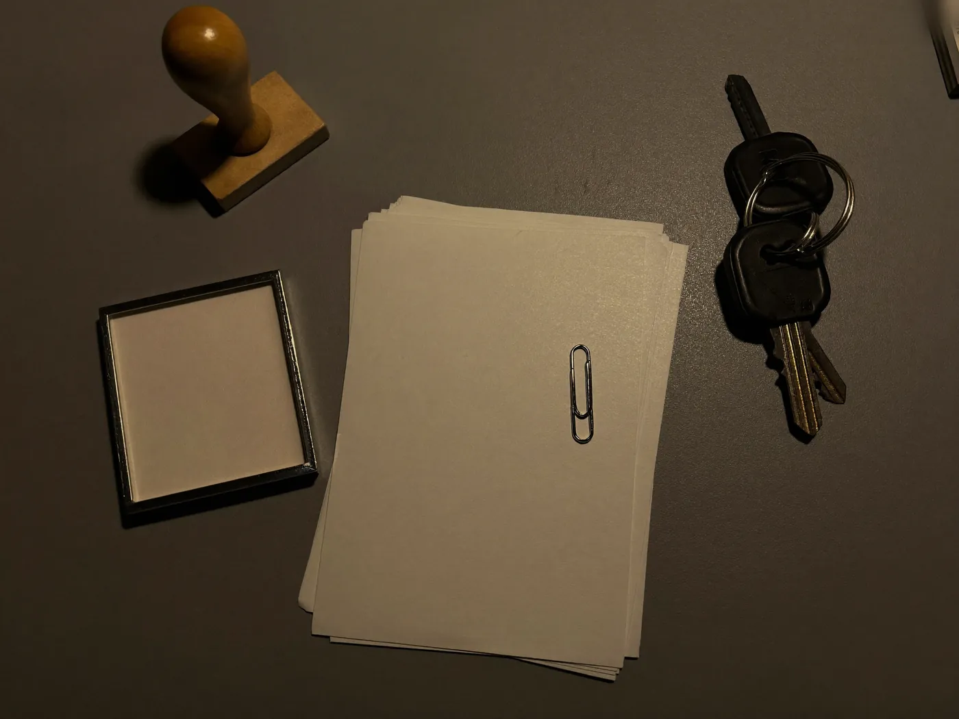 Documents being stamped on a bright office desk