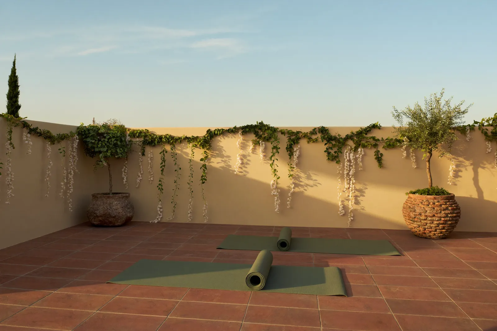 Rooftop terrace set for a sunrise class above the coast